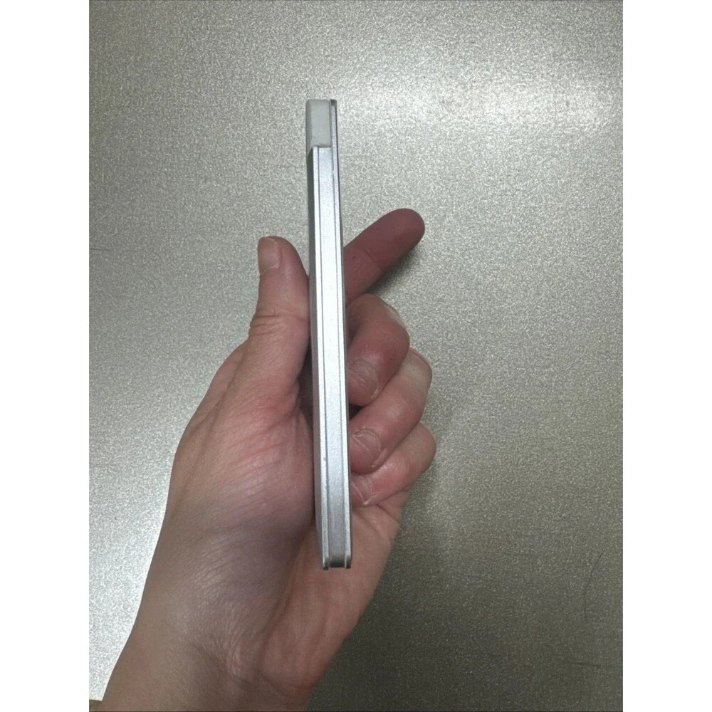 Ultra Slim portable charger silver with looks like Micro-USB cord see photos